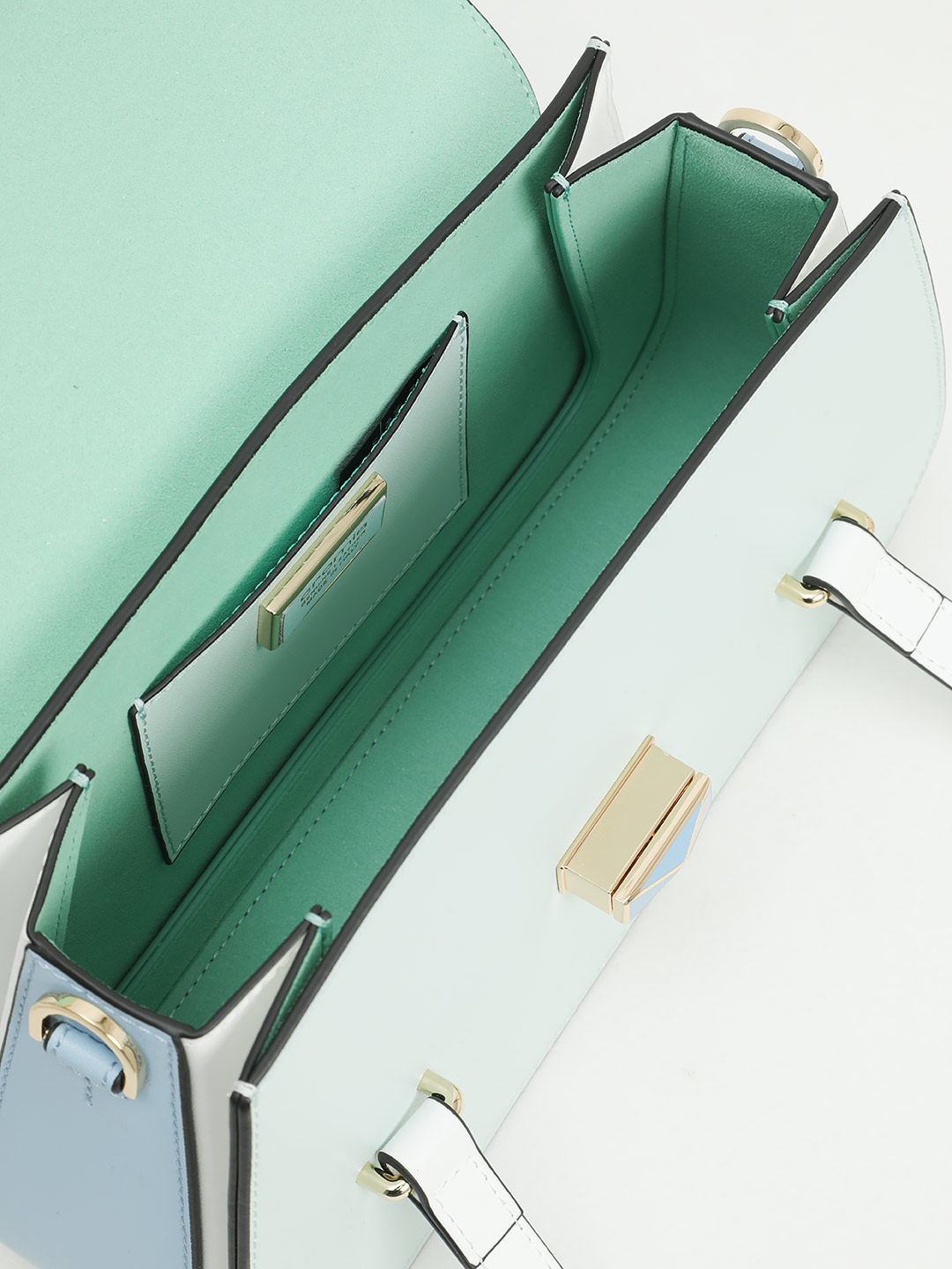 Сумка трапециевидной формы с поворотным замком на фирменной пряжке от Cromia из голубой кожи