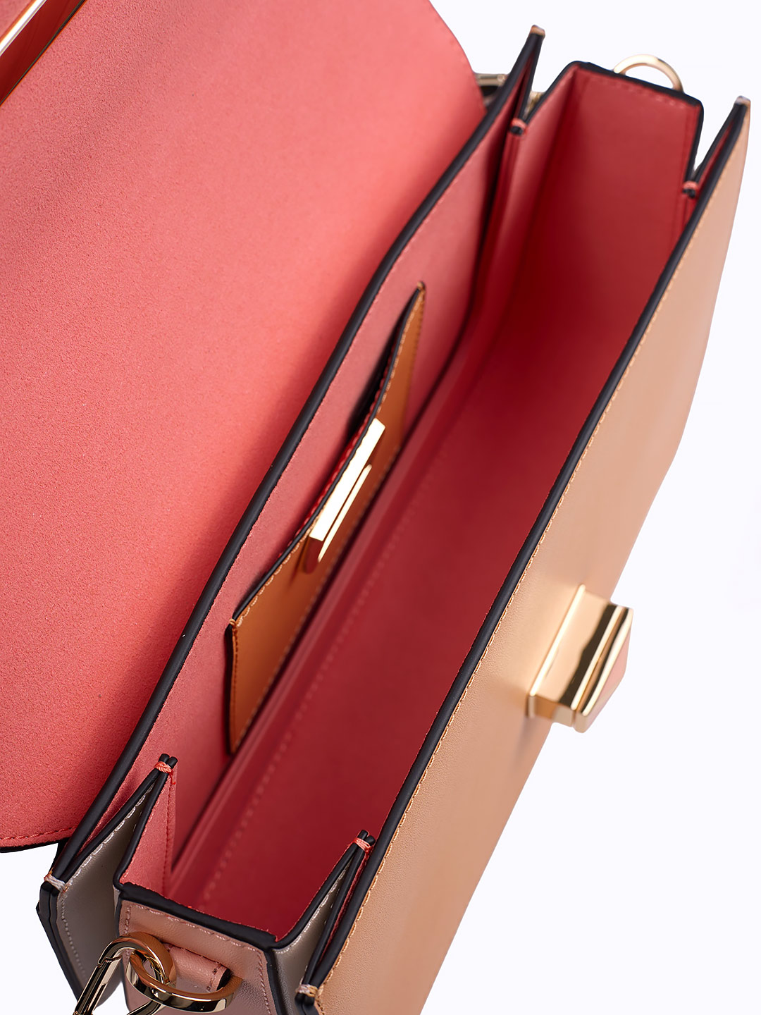 Сумка-багет с поворотным замком на фирменной пряжке от Cromia из кожи рыжего и розового цвета