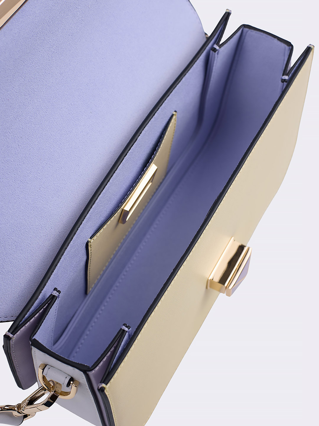 Сумка-багет с поворотным замком на фирменной пряжке от Cromia из кожи желтого и сиреневого цвета