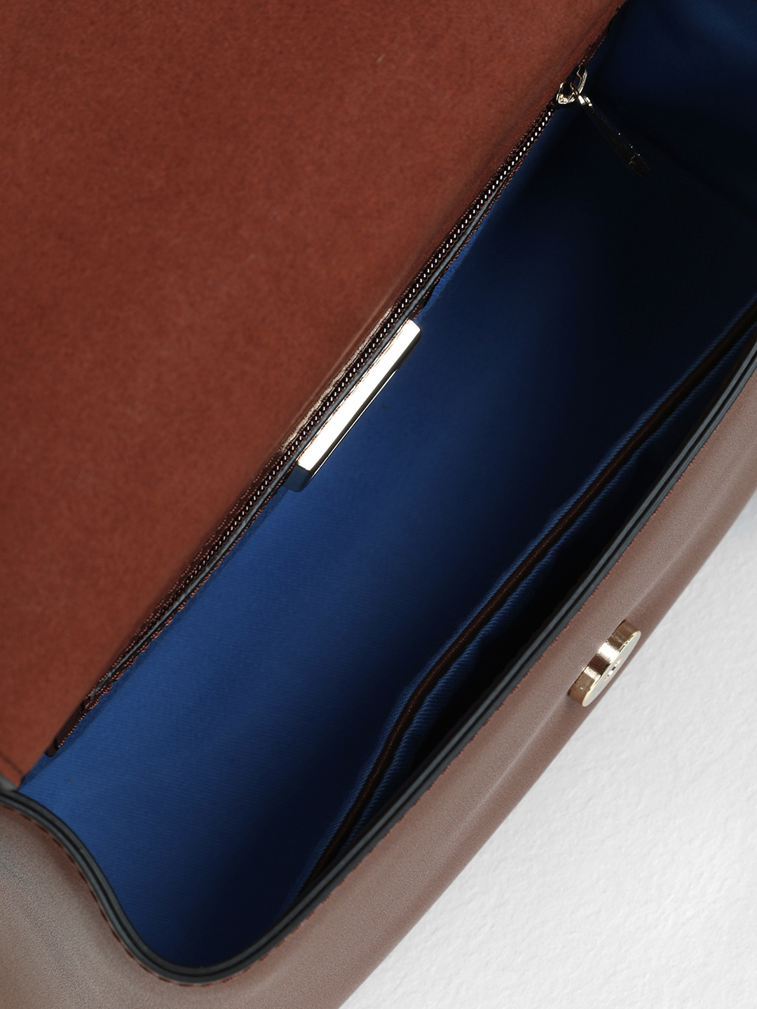 Сэтчел от бренда CROMIA в гладкой коже с оригинальной ручкой и переплетением коричнево-рыжего цвета